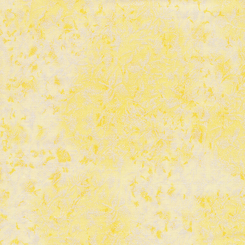 Tonal light yellow fabric features mottled design with metallic frost accents