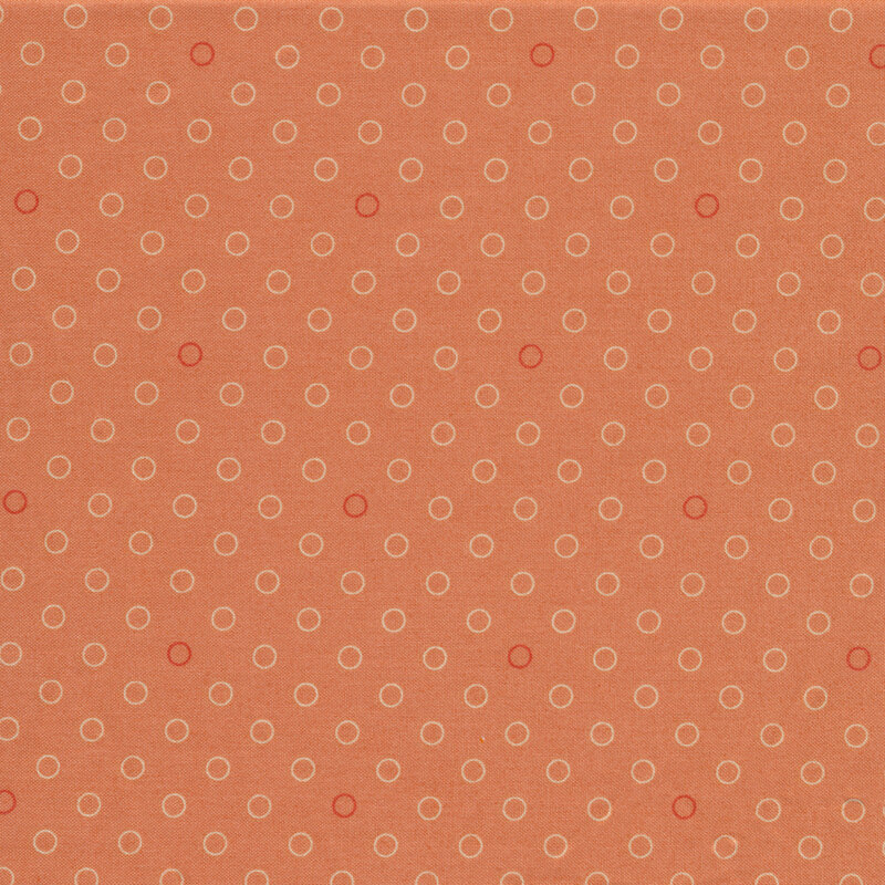 A basic coral polka dot fabric with tonal rings | Shabby Fabrics