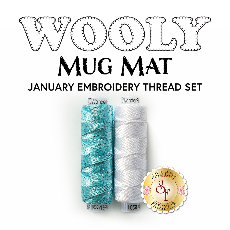 Wooly Mug Mat January Embroidery Thread Set featuring two spools of thread in aqua and white isolated on a white background.