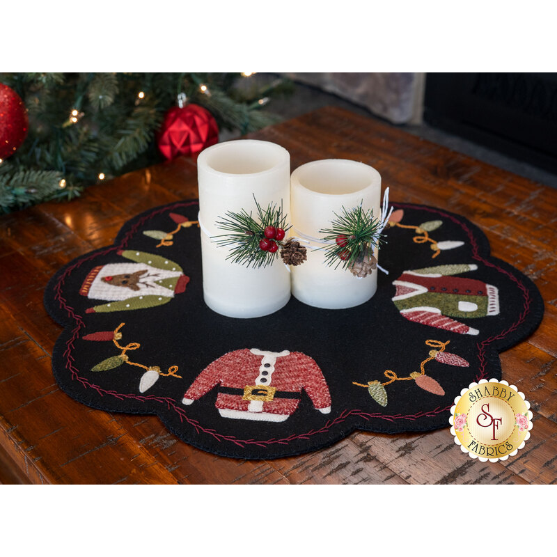 Finished Ugly Sweater Scalloped Mat displayed with Christmas candles | Shabby Fabrics