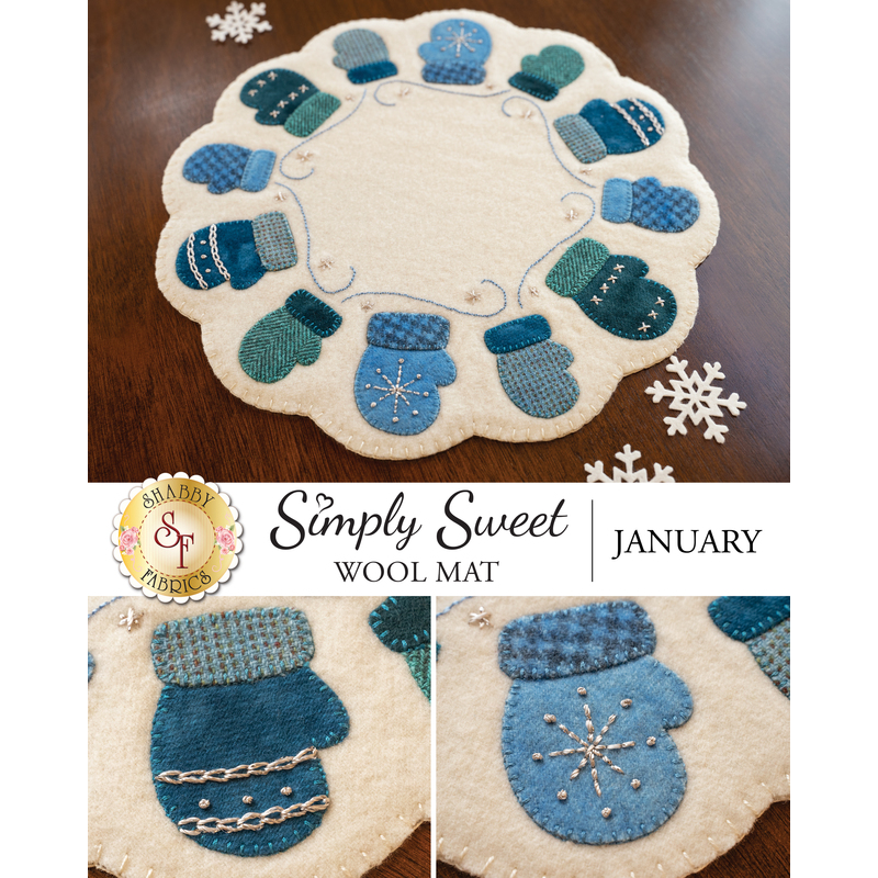 A circular wool mat featuring decorative mittens in shades of blue and green arranged around the edge. The center has a light cream color with snowflake designs. The design is titled Simply Sweet Wool Mat and labeled for January.