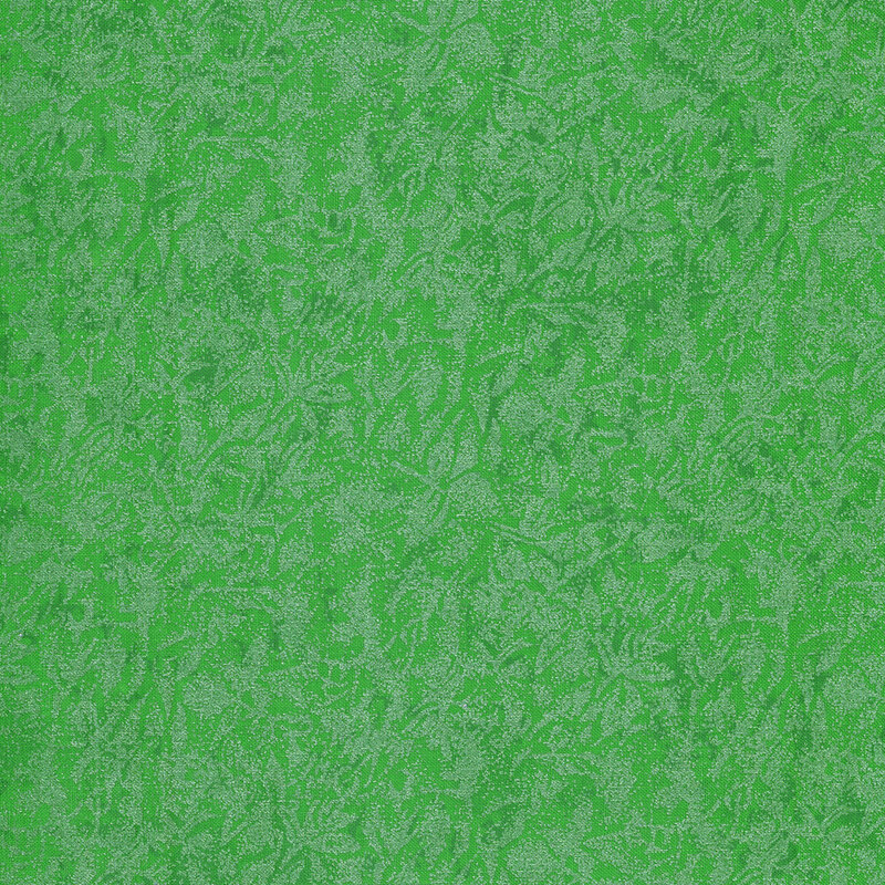 Tonal green fabric features mottled design with metallic frost accents