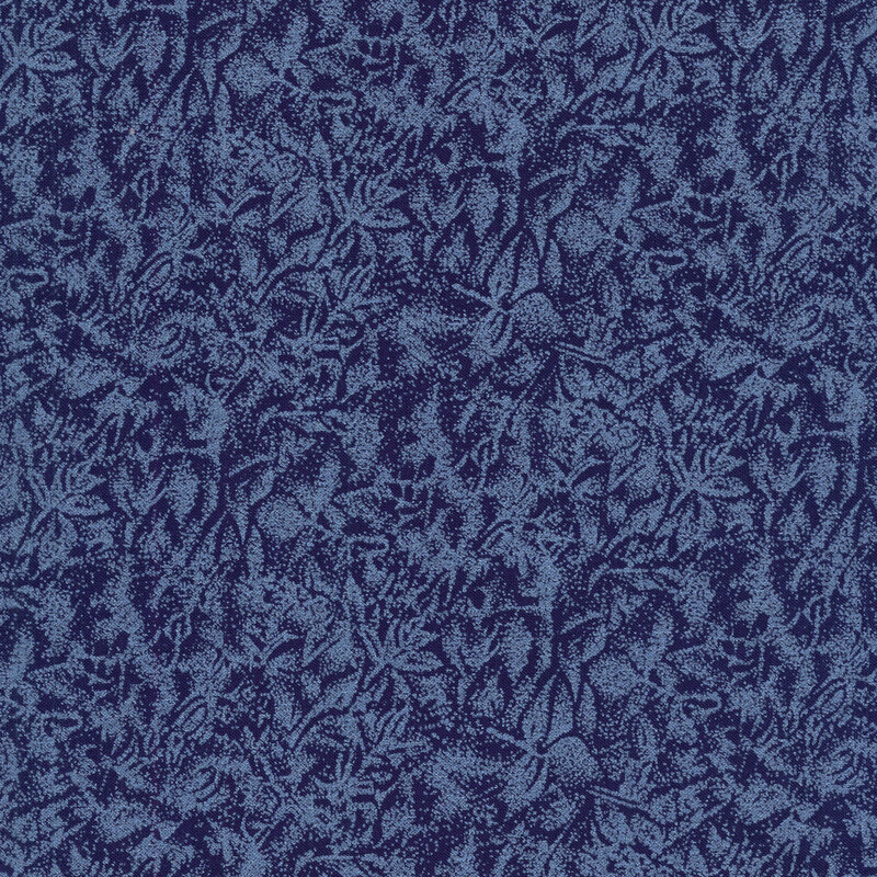 Tonal indigo blue fabric features mottled design with metallic frost accents