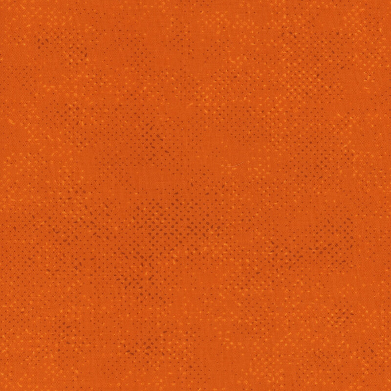 Textured orange fabric with a pattern of small tonal speckles