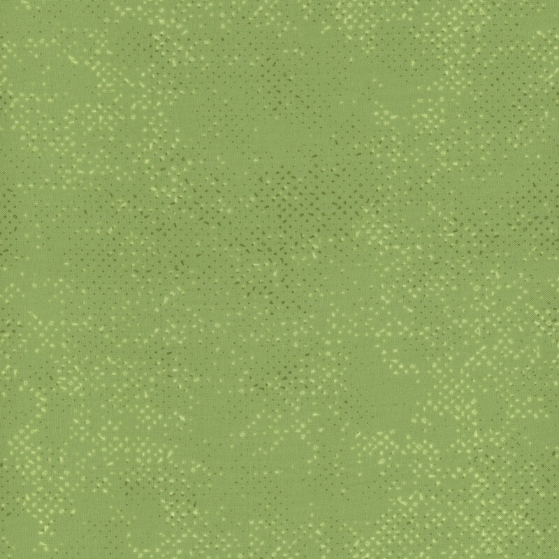 Textured green fabric with a pattern of small tonal speckles