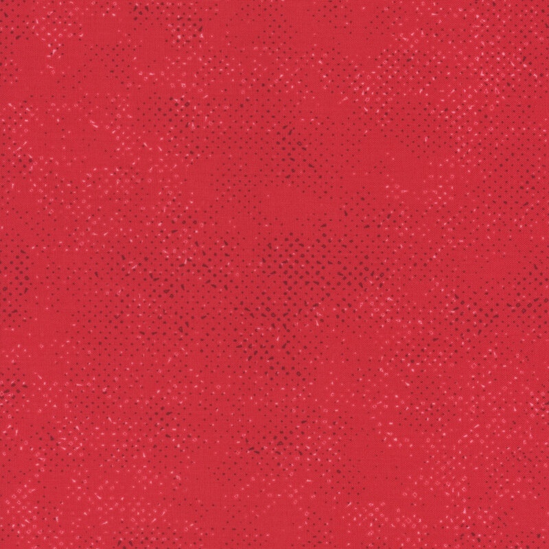 Textured watermelon red fabric with a pattern of small tonal speckles