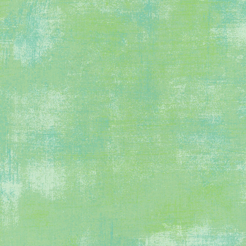 Textured mint green grunge fabric.