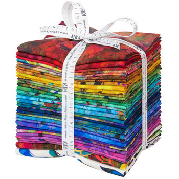 Colorful bundle of folded and stacked fabric tied with white bow