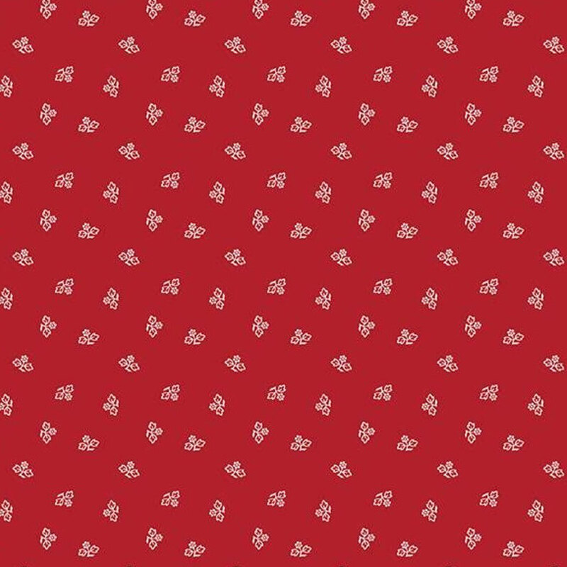 Red fabric with a repeating white floral pattern, featuring small blossoms and leaves.