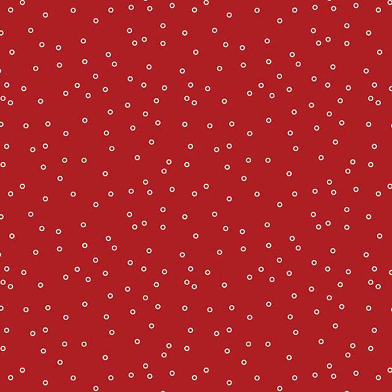 Red background featuring evenly spaced white circles, creating a polka dot pattern.