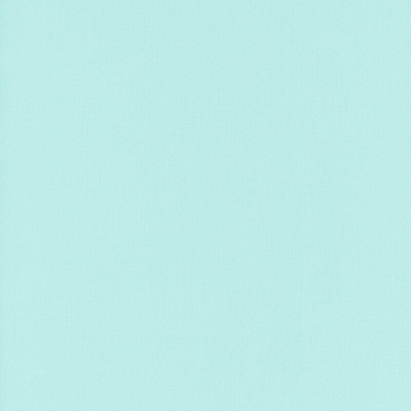 A slight light teal solid cotton fabric