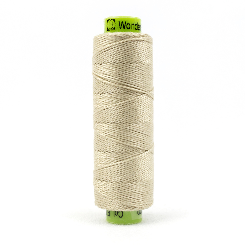 A spool of WonderFil Eleganza #8 EZ01 Sea Shell thread on a white background