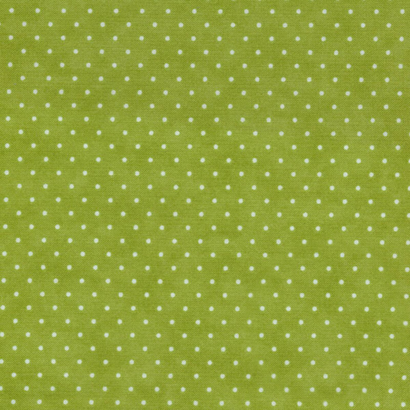 Grass green fabric with small white polka dots throughout