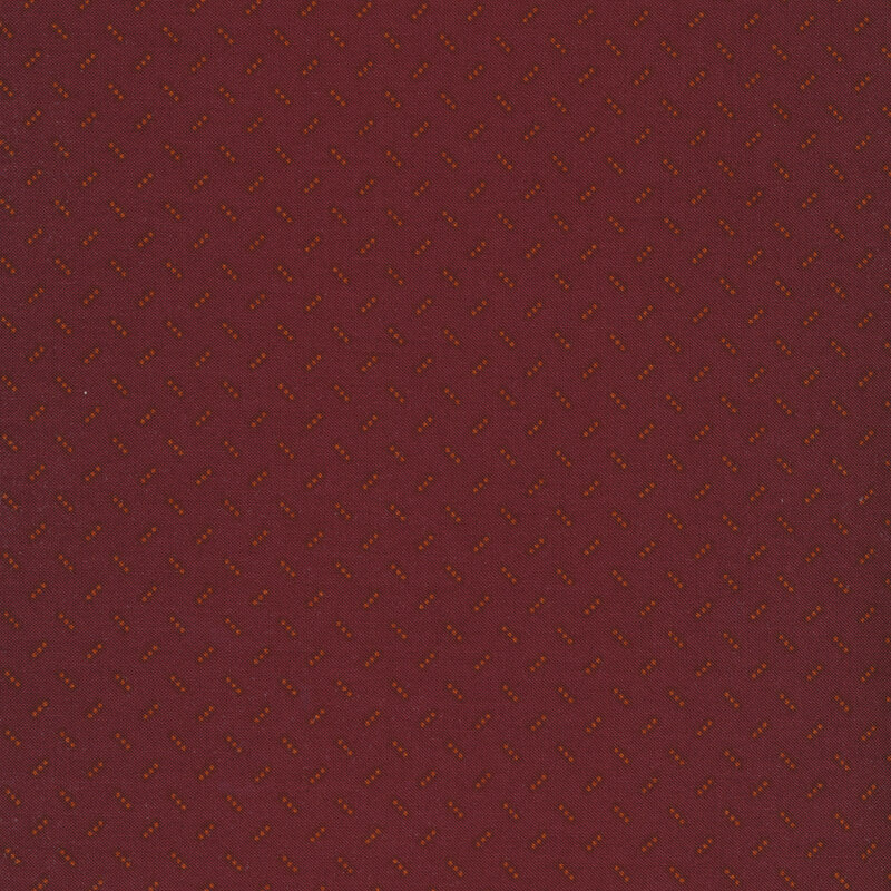 Alternating light brown three dot clusters on a dark red background