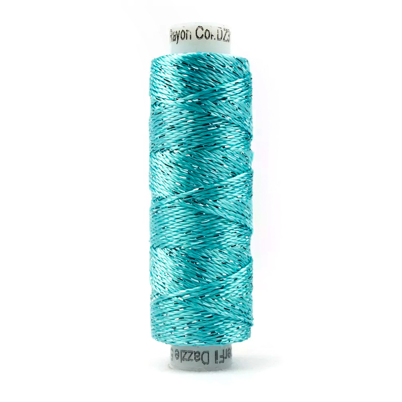 A spool of WonderFil Dazzle 3130 - Aqua Sea thread on a white background